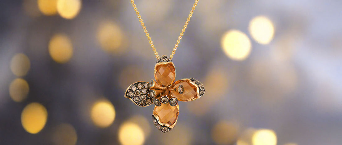 A citrine and yellow gold flower pendant necklace