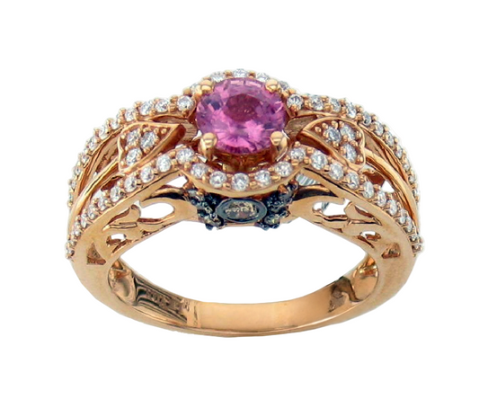 The Le Vian 1 3/8 cts Red Sapphire Cocktail Ring in 14K Rose Gold showcases a round red sapphire centerpiece, chocolate diamonds along the band, and elegant filigree details for a luxurious finish.